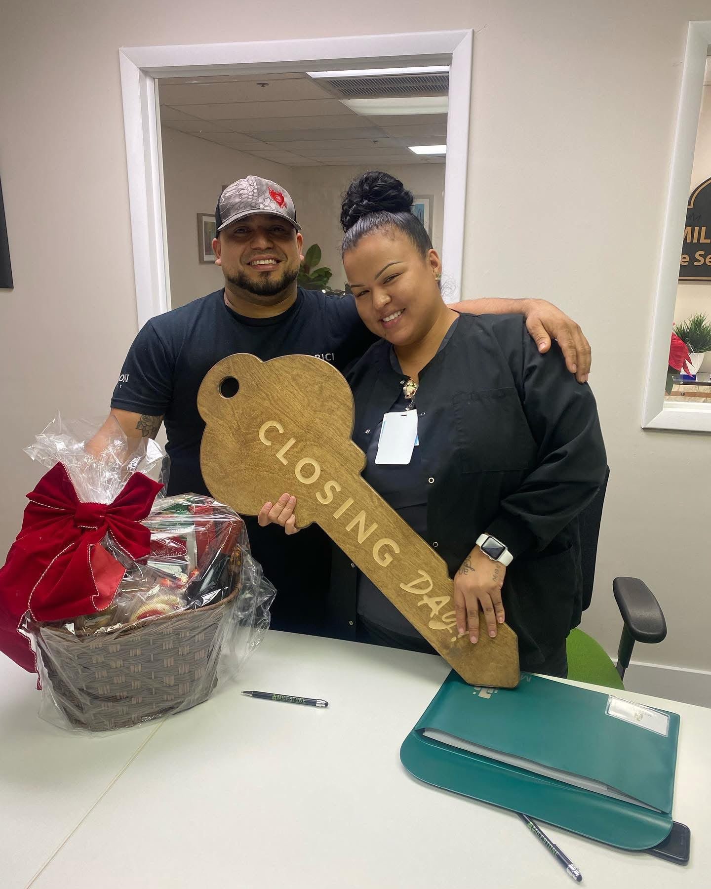 Happy closing day clients with key
